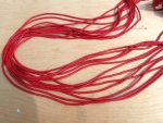 Bakelit Scheiben 3mm hellrot, Strang ca. 75 cm